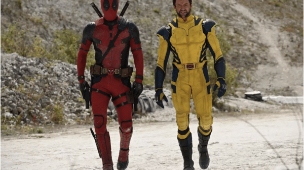 Deadpool (left) and Wolverine (right) standing side by side in uniform.